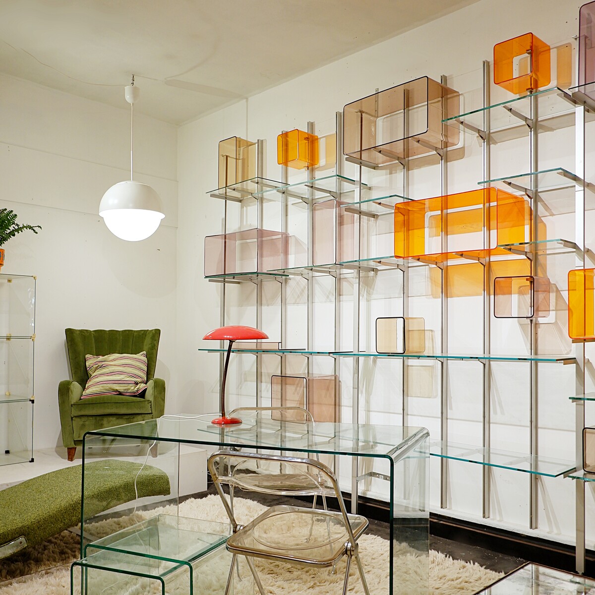 Modular wall shelf in brushed metal, glass and acrylic, in the style of Michel Ducaroy