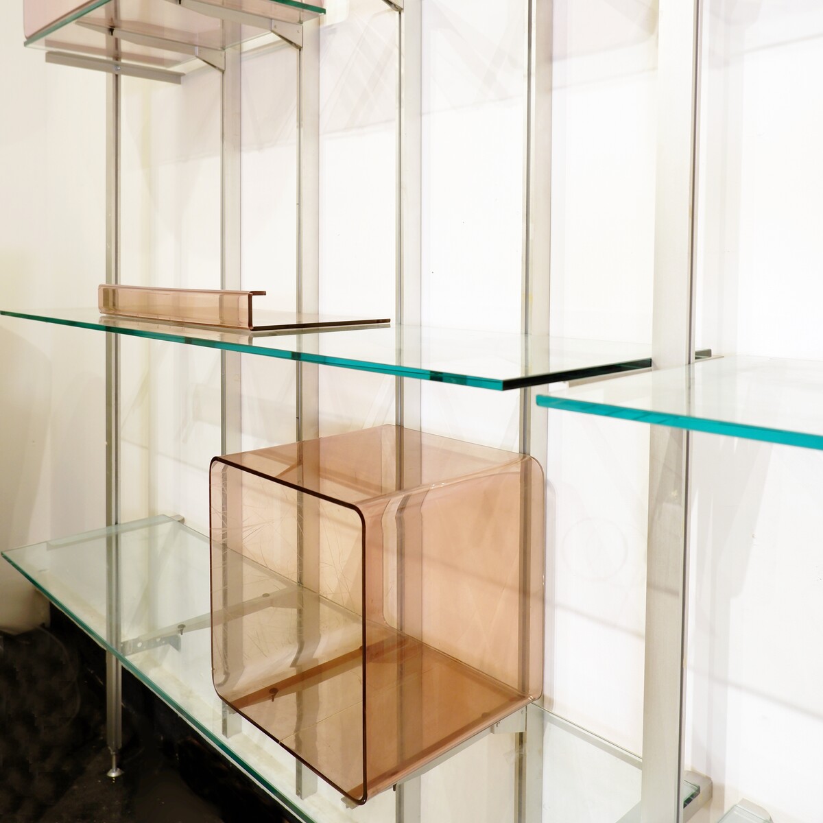 Modular wall shelf in brushed metal, glass and acrylic, in the style of Michel Ducaroy