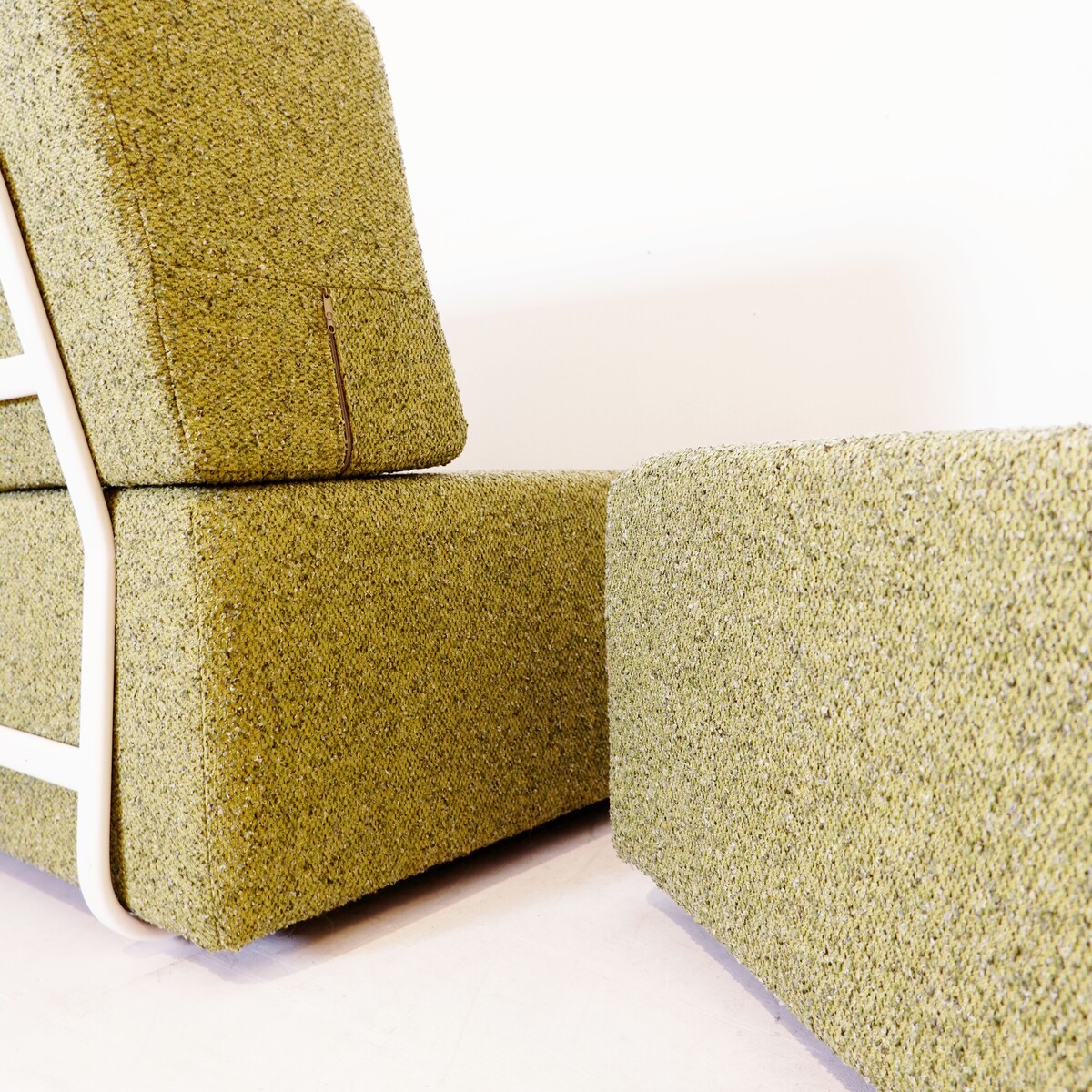 Pair of lounge chairs with white metal frame and new mottled green upholstery