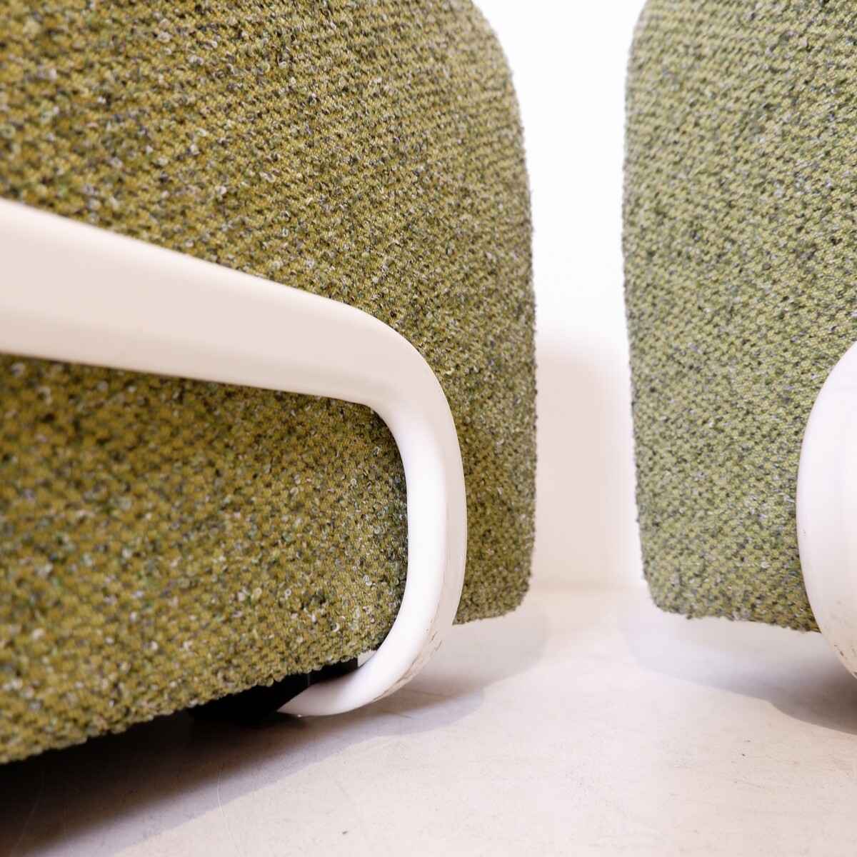Pair of lounge chairs with white metal frame and new mottled green upholstery