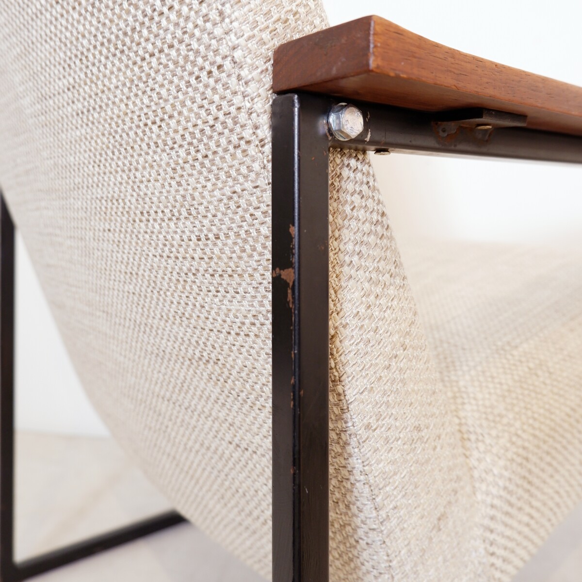 Pair of mid-century armchairs with black metal frames and wooden armrests - New Upholstery