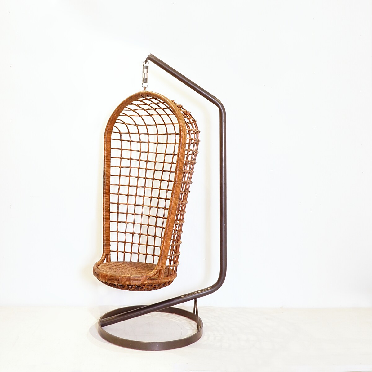 Hanging armchair in woven wicker on a steel frame, circa 1970