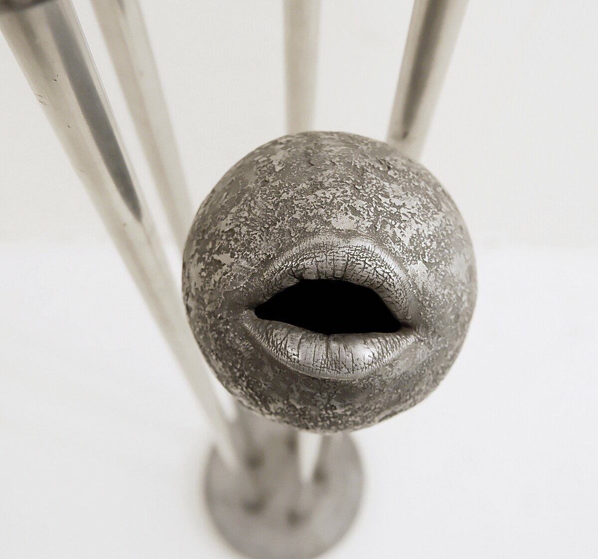 john cotter abstract lips metal sculpture - signed to metal pad on base