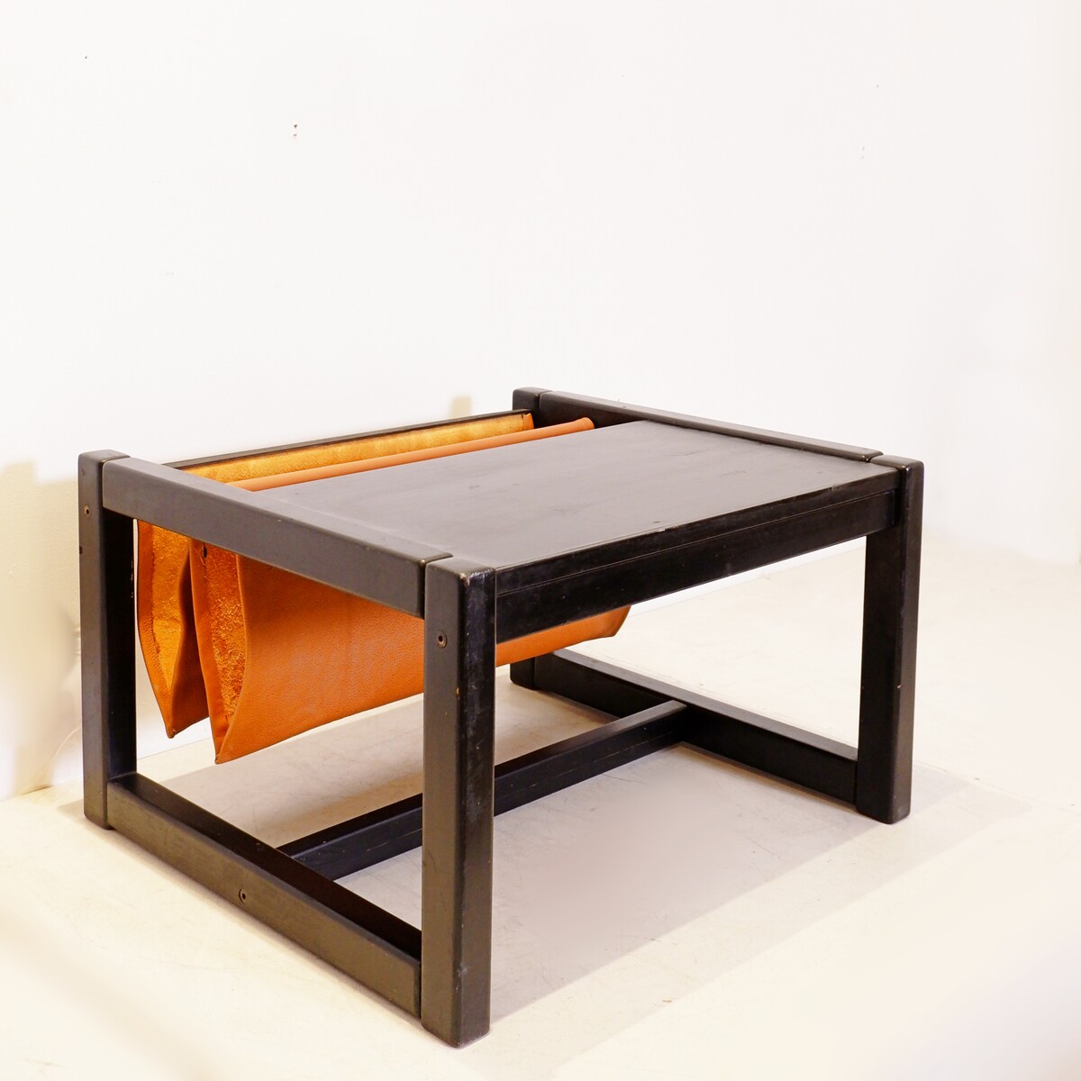 Mid-Century Coffee table with leather magazine rack