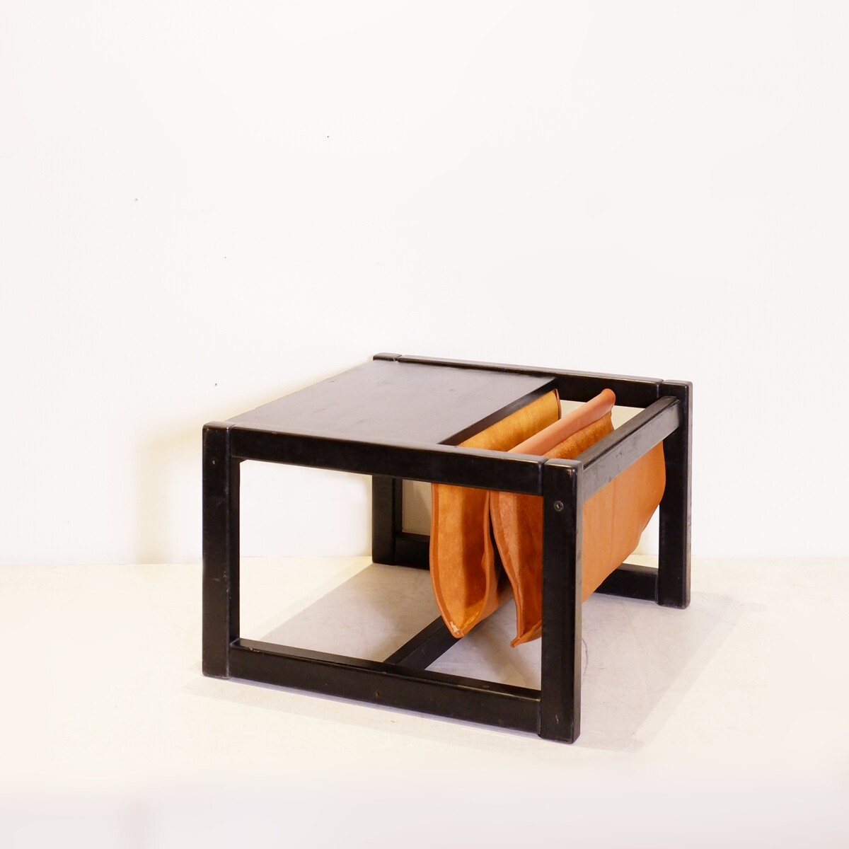 Mid-Century Coffee table with leather magazine rack