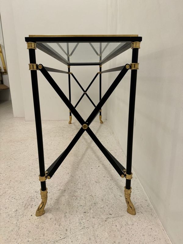 Neoclassical console in black lacquered metal and brass