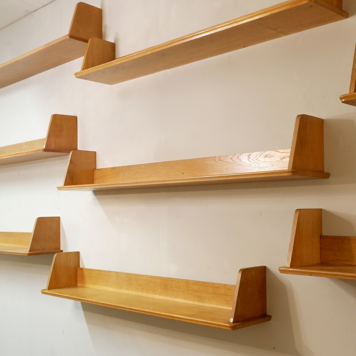 Nine wooden wall shelves