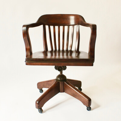 Office armchair made in the USA, curved model with swivel, tilt, and height adjustment features, circa 1950.