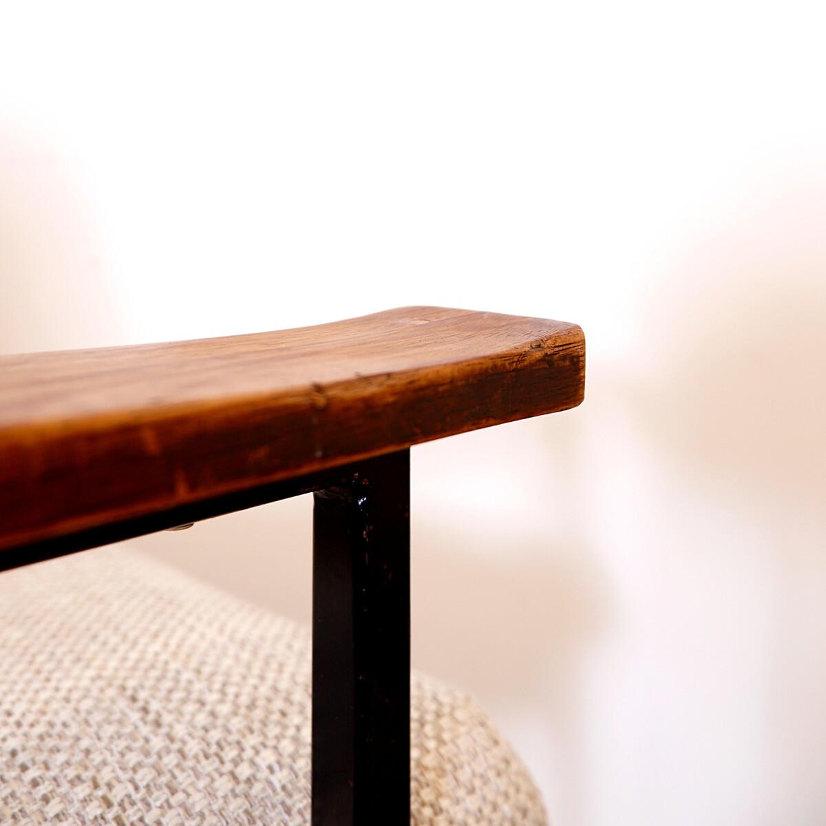 Pair of mid-century armchairs with black metal frames and wooden armrests - New Upholstery