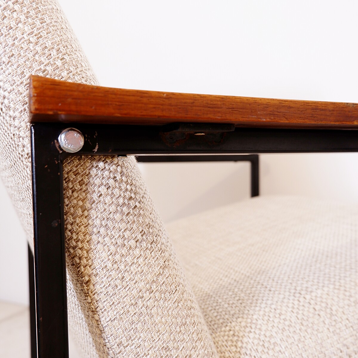 Pair of mid-century armchairs with black metal frames and wooden armrests - New Upholstery