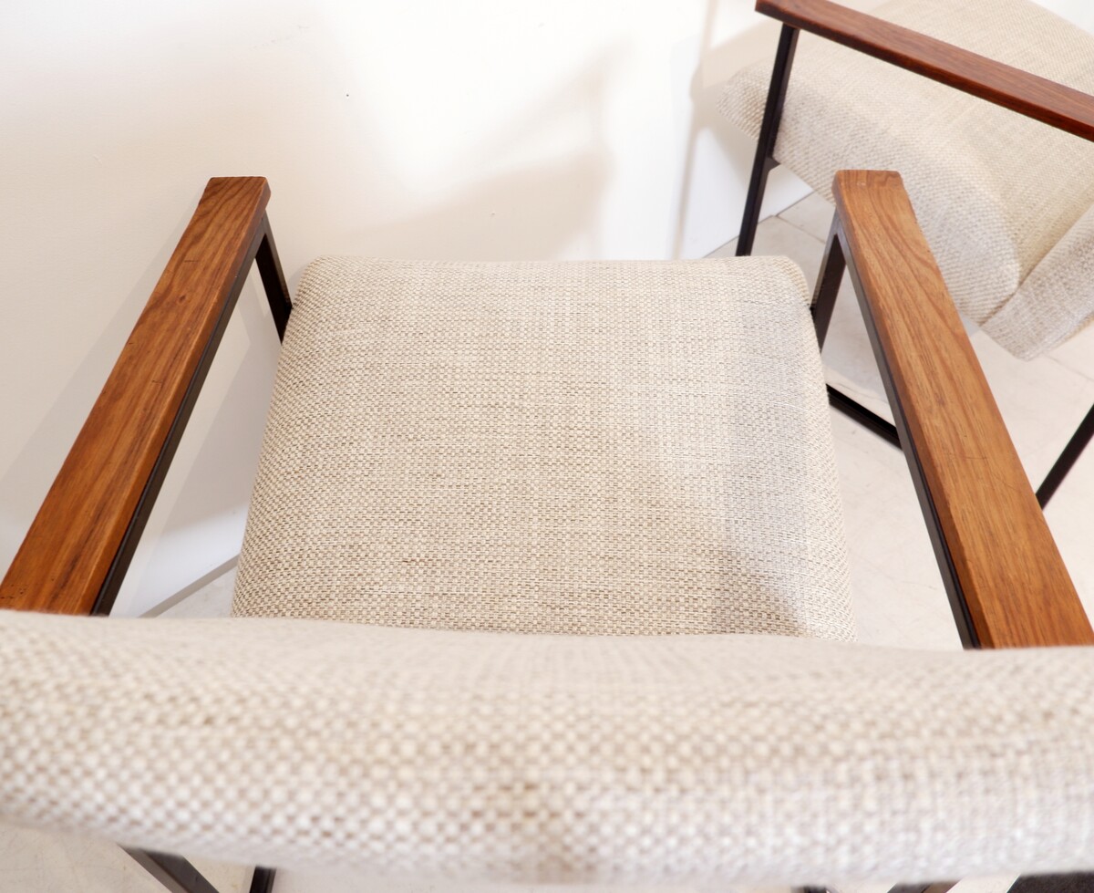 Pair of mid-century armchairs with black metal frames and wooden armrests - New Upholstery