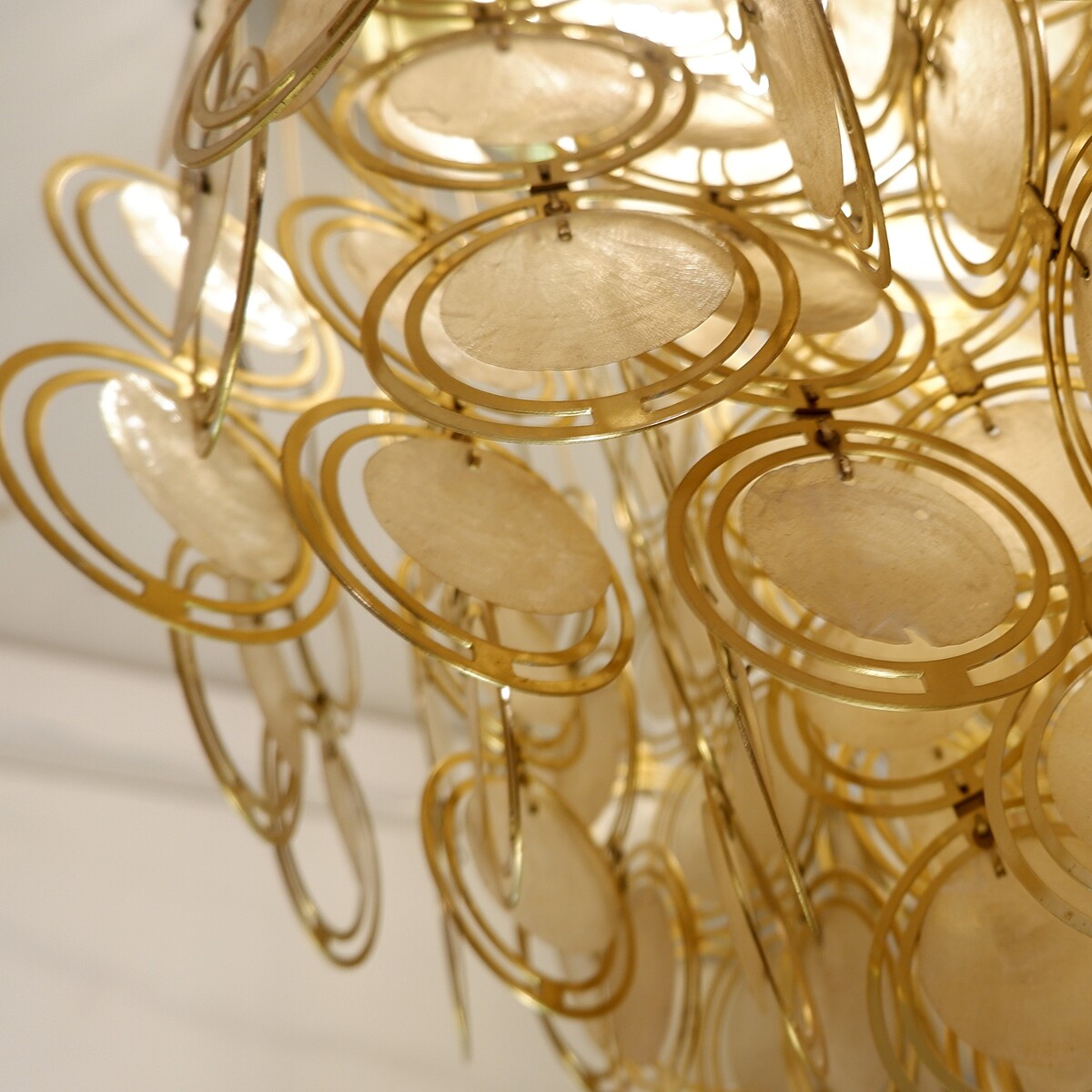Pendant Light Chandelier Panton style with mother-of-pearl discs and laiton circles.