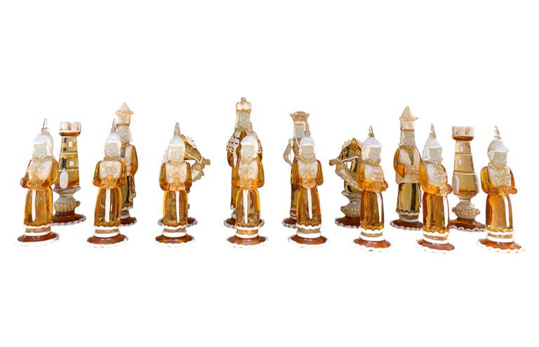 Rare Chess Set Composed of 32 Solid Amber Glass Pieces, finished in white or black pâte de verre, with gold leaf decoration, Pauly & C, Murano, 1930s